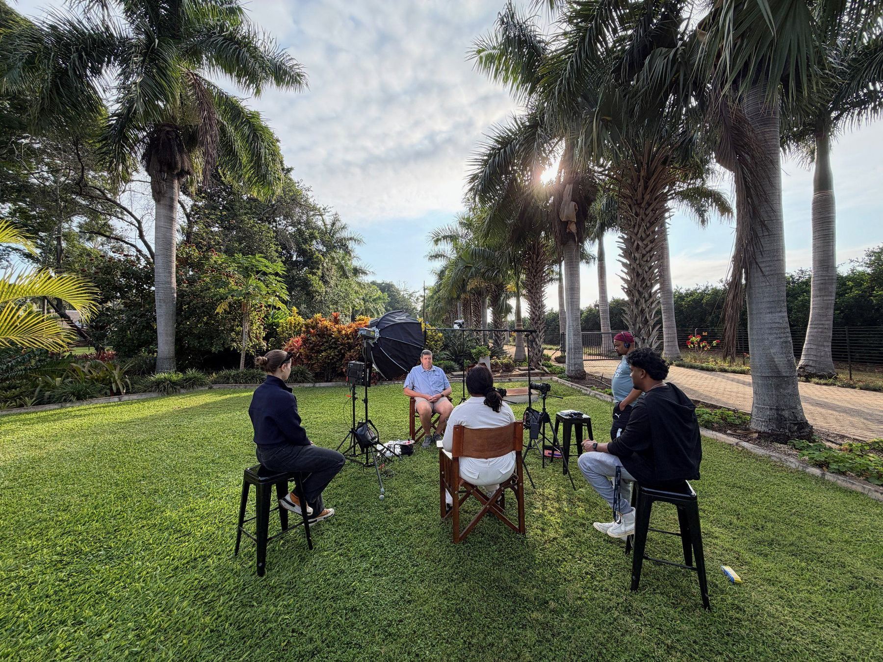 An outdoor interview under the palms