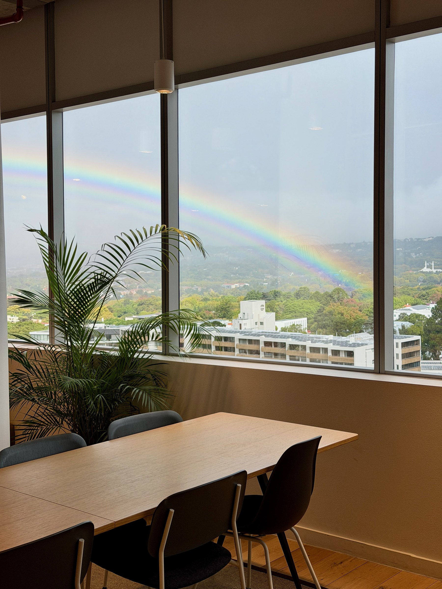 A rainbow over Joburg from the meeting room