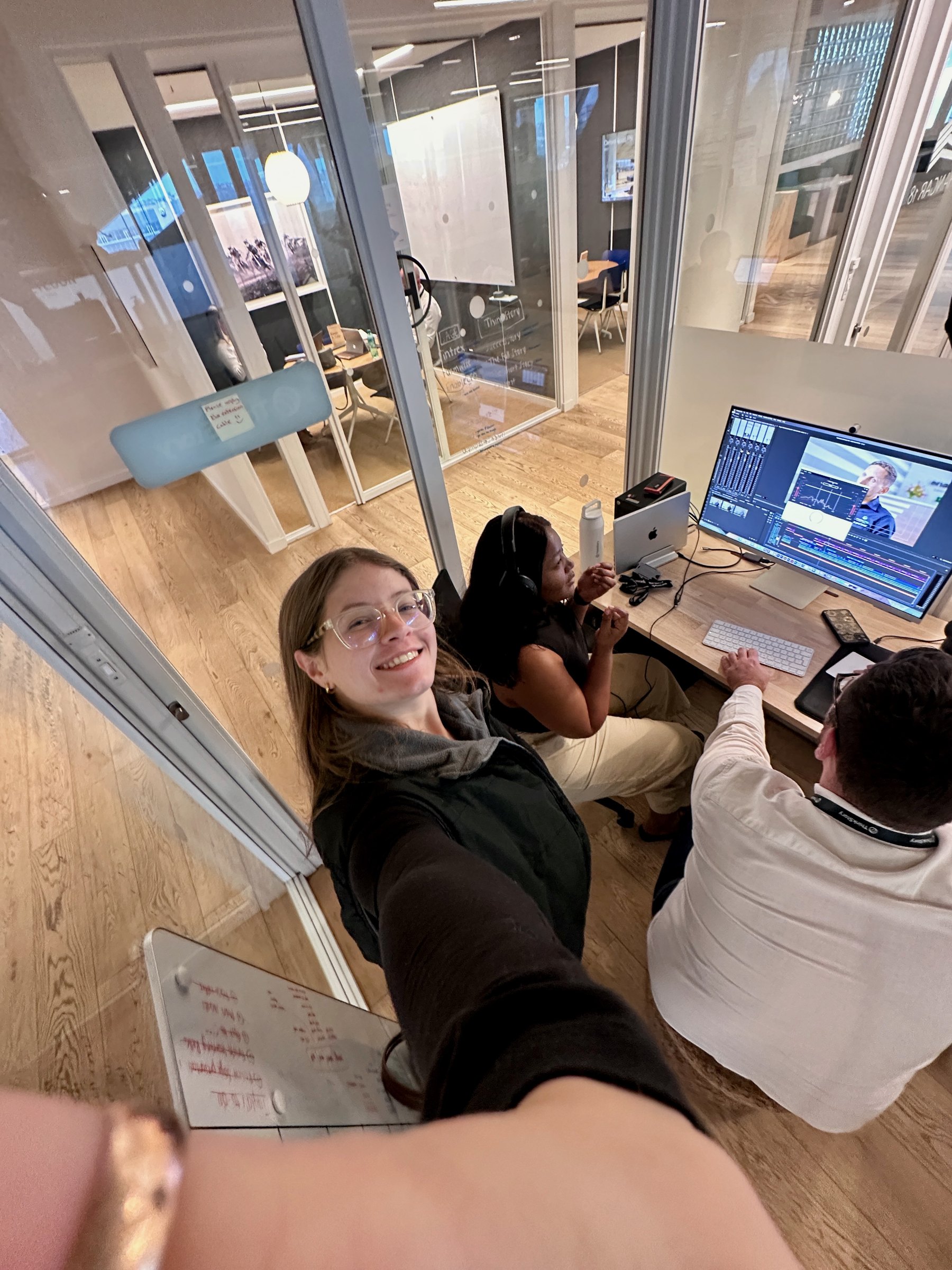Squeezed around a monitor reviewing a cut