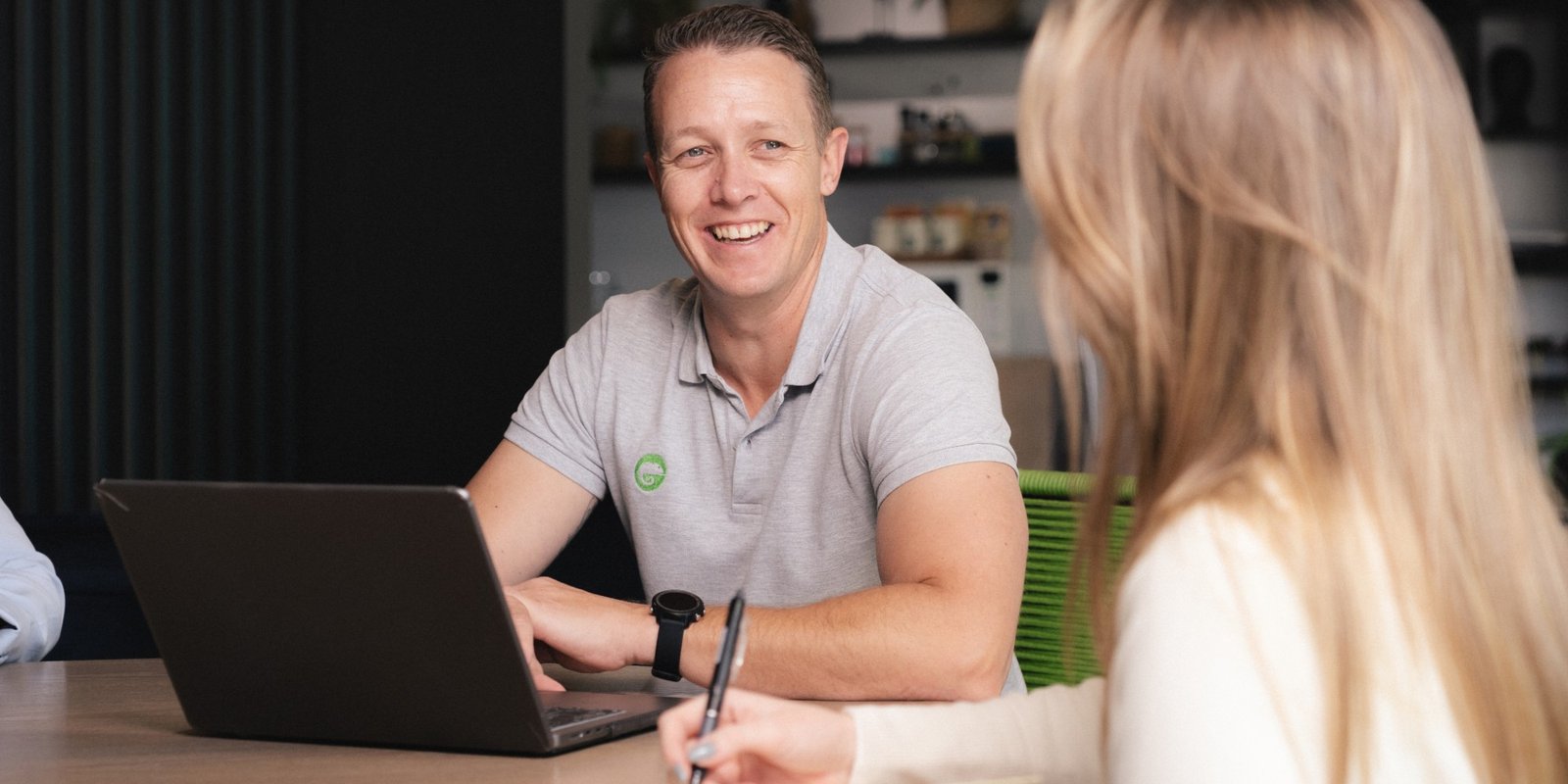 A friendly ThinkStory client meeting across a laptop