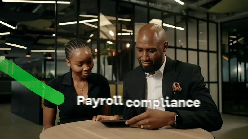 A still from the tax year-end TVC we produced for Sage, two colleagues reviewing payroll on a tablet