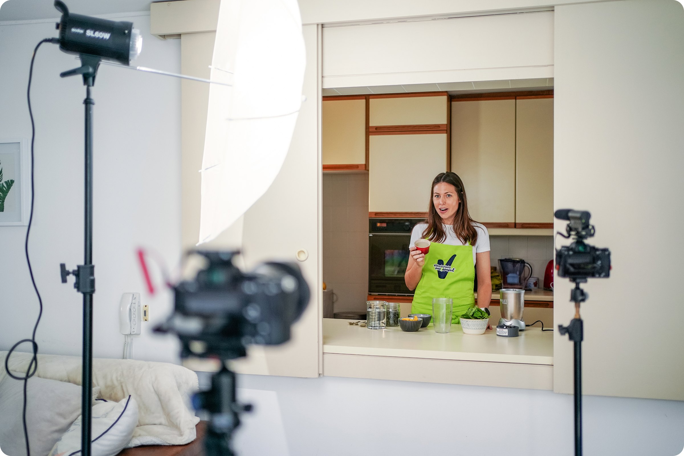 Filming a kitchen segment with the mascot
