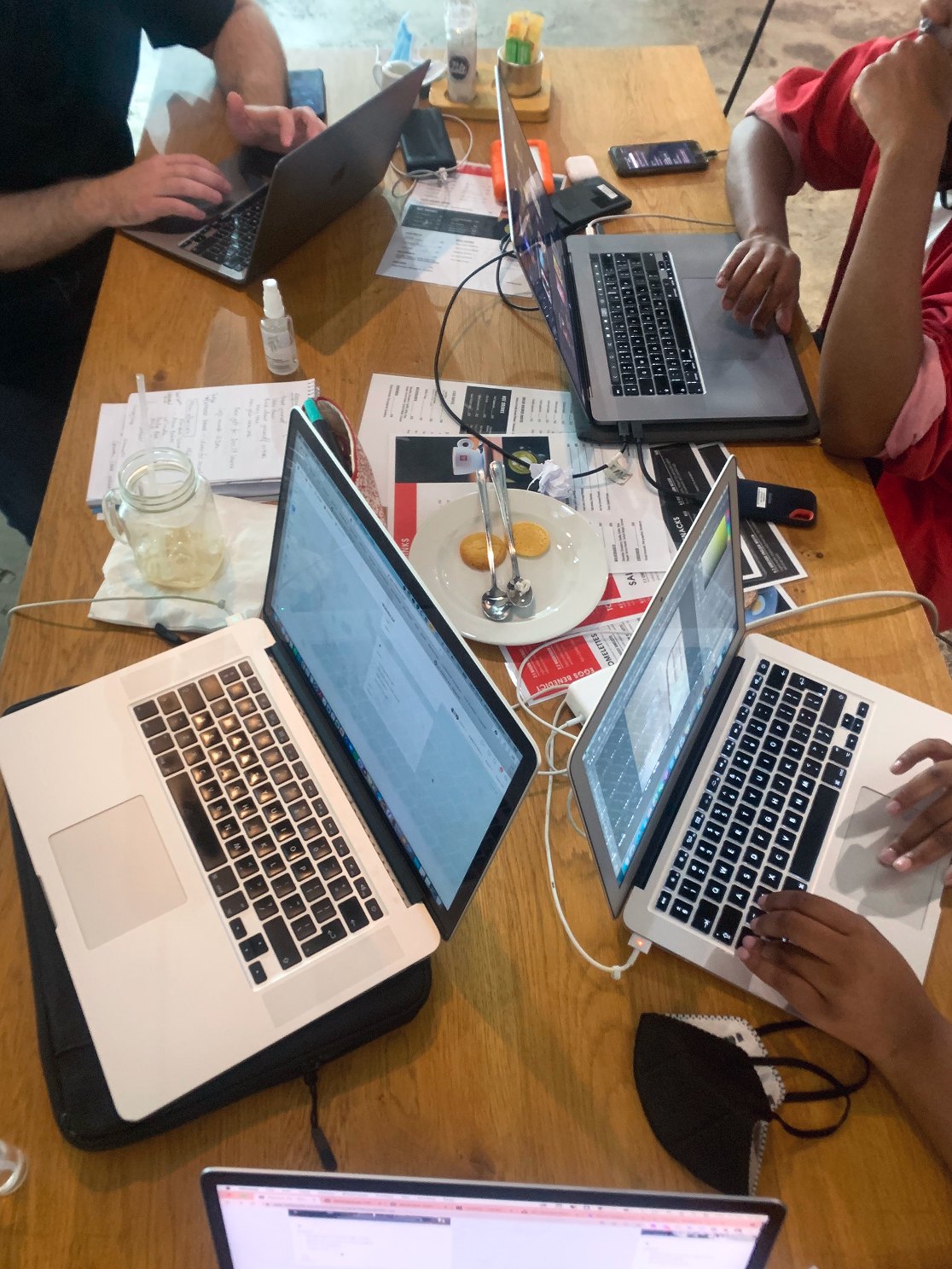 Laptops round the table mid-workshop