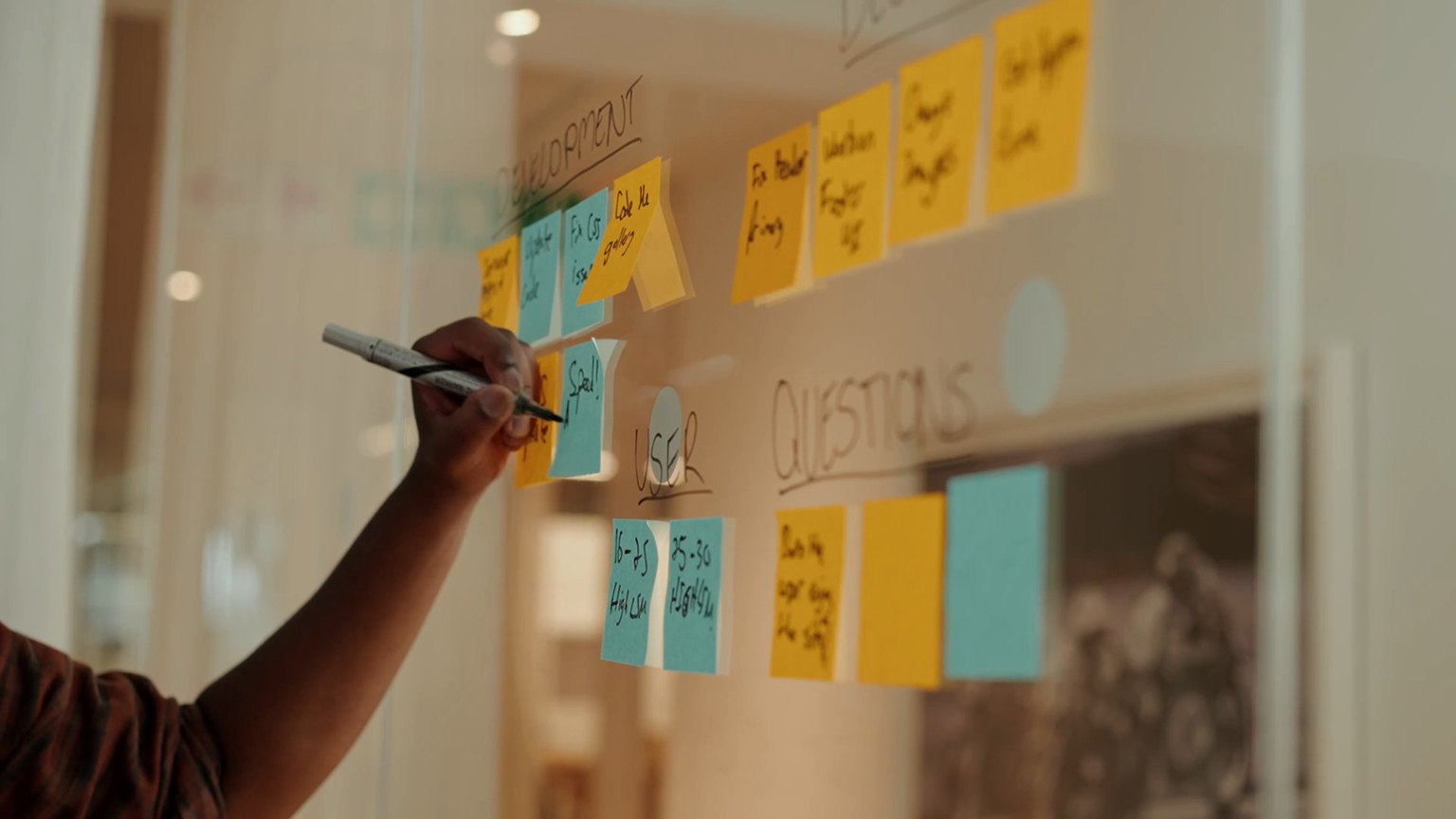 Sorting the sticky notes on the glass