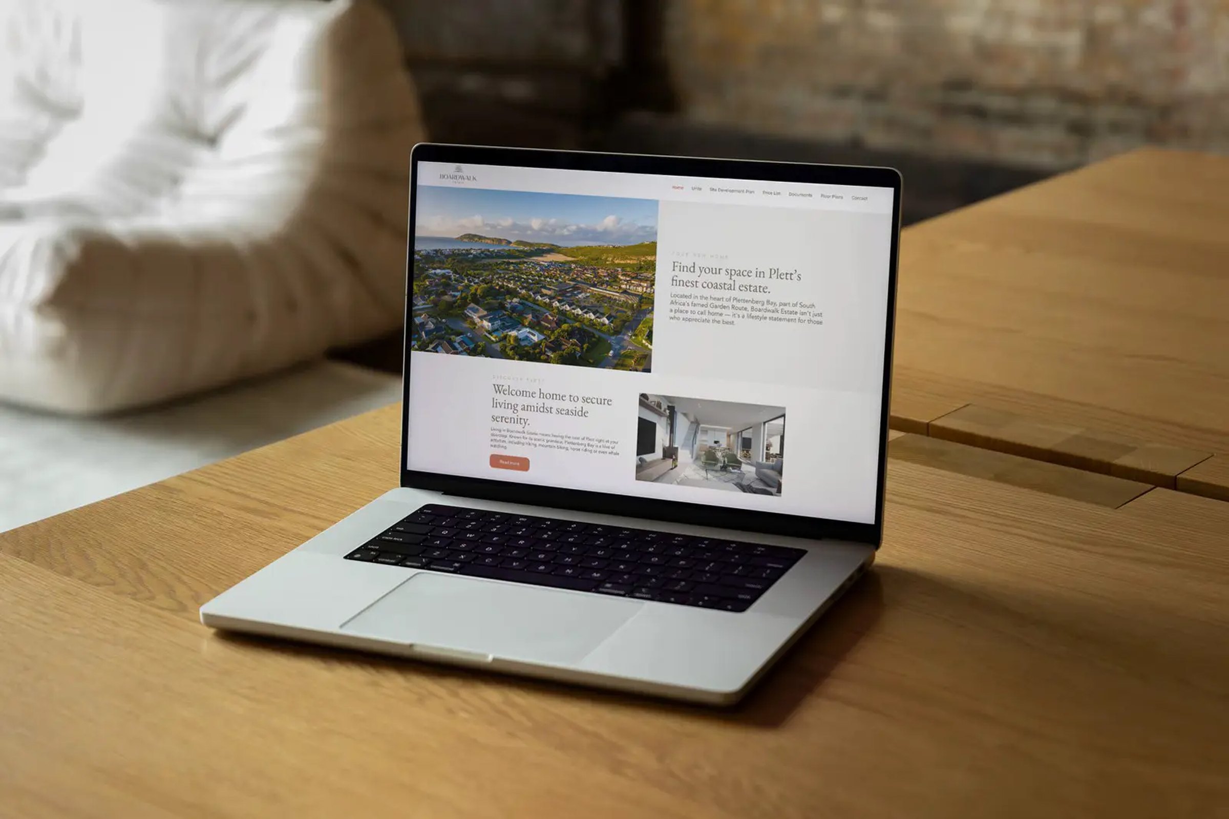 Boardwalk Estate on a laptop on the couch