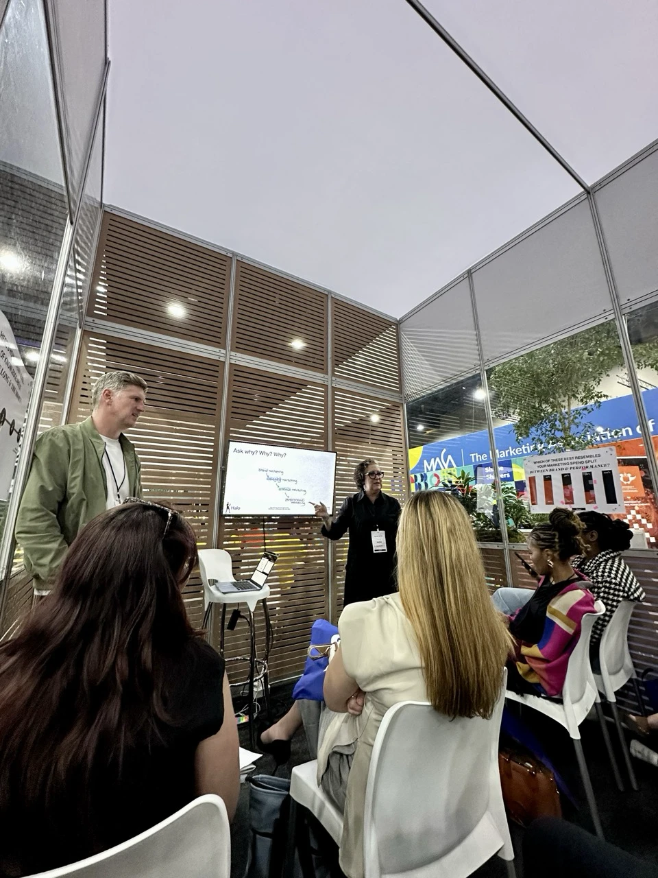 A speaker presenting to a full stand at LeaderEx