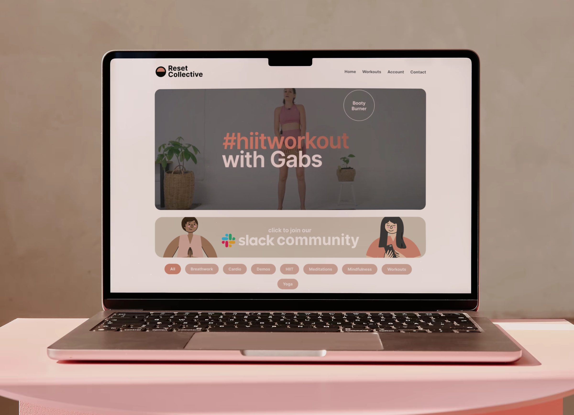 The Reset Collective subscription platform on a laptop