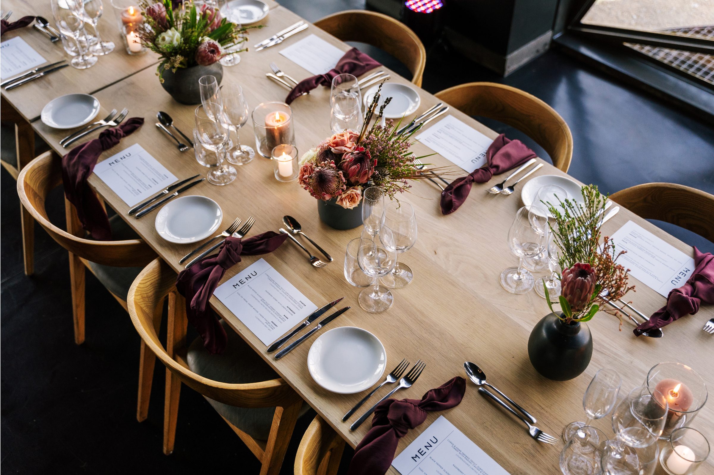 An event table set with menus at Zeitz MOCAA, photographed during live service