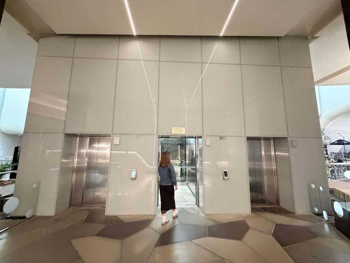 The lift bank (A, B and C) — press the button for Reception