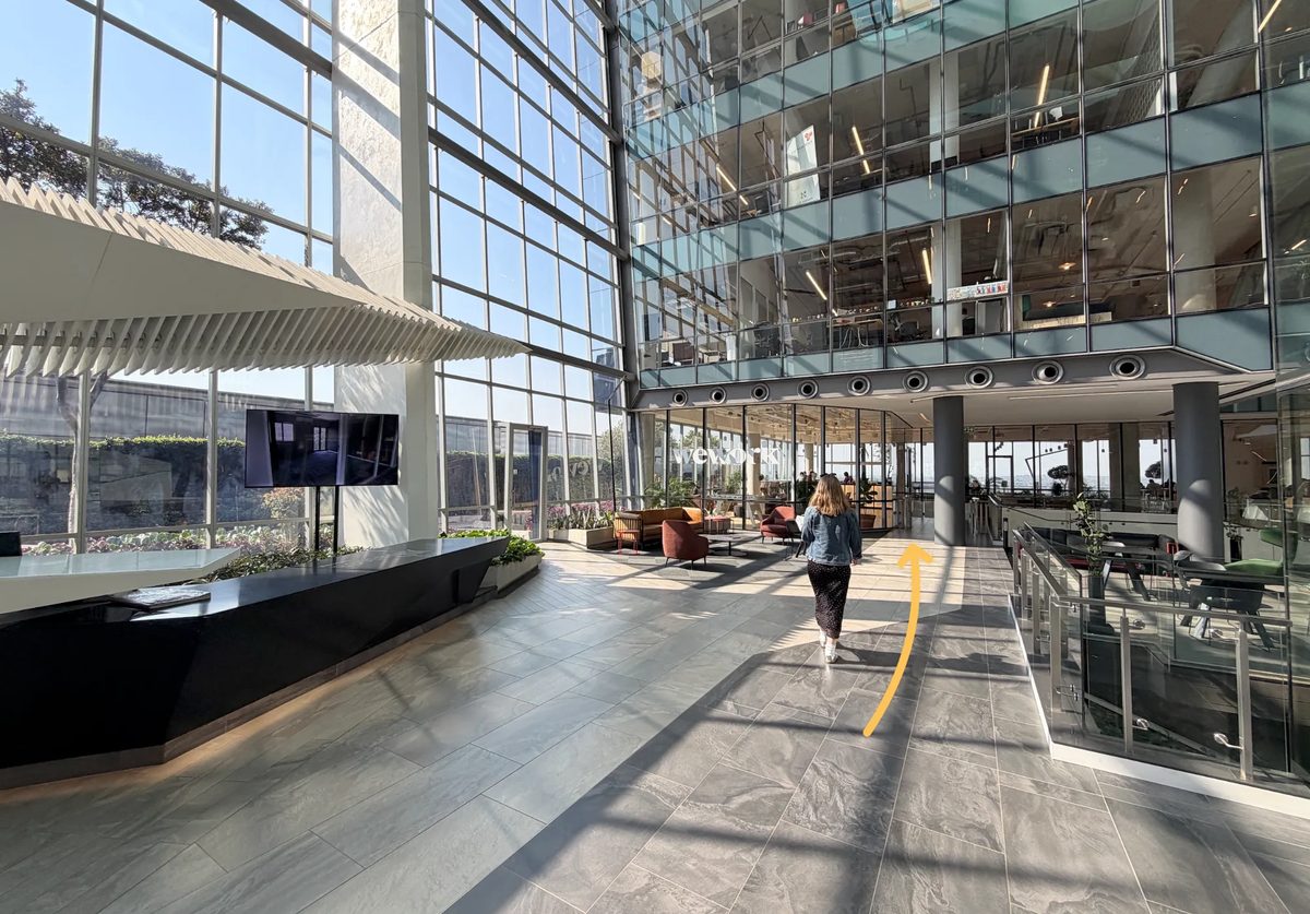 The bright WeWork reception atrium at the top of the lifts